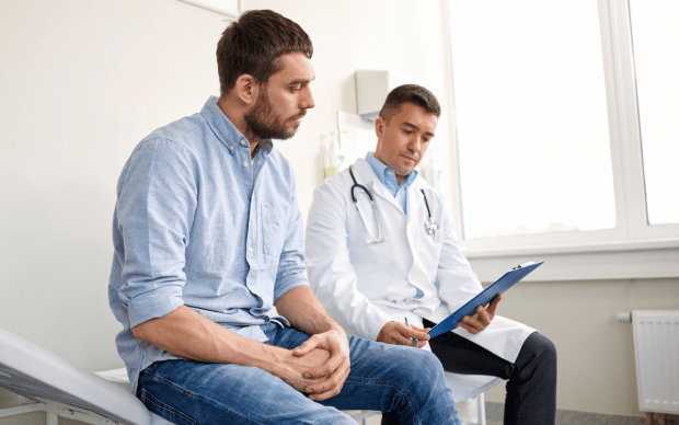 a patient goes over labs with his doctor 